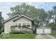 Charming single-Gathering home featuring a front porch and detached two car garage at 237 Ringwood Way, Anderson, IN 46013