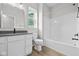 Well-lit bathroom with wood-look floors, and a shower-tub combination at 3544 Wrangler Dr, Bargersville, IN 46106