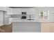 Bright kitchen featuring white cabinets, stainless steel appliances, a large island with a sink, and modern countertops at 3544 Wrangler Dr, Bargersville, IN 46106