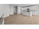 Spacious living space featuring an open kitchen, dining, and living areas with hardwood floors at 3544 Wrangler Dr, Bargersville, IN 46106