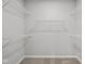 Spacious walk-in closet features carpet and white shelving for efficient storage at 3544 Wrangler Dr, Bargersville, IN 46106