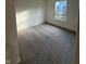 Cozy bedroom featuring neutral carpeting, ample natural light, and serene atmosphere at 11015 Walter Dr, Indianapolis, IN 46235