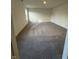 Well lit bedroom features neutral carpet and a large window overlooking the side yard at 11015 Walter Dr, Indianapolis, IN 46235