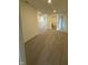 Bright hallway featuring neutral carpet, white trim, and access to multiple rooms at 11015 Walter Dr, Indianapolis, IN 46235