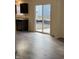 Contemporary kitchen featuring stainless steel appliances, dark cabinetry, and a sliding glass door at 11015 Walter Dr, Indianapolis, IN 46235