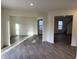 Spacious living room featuring hardwood floors, natural light, and an open layout at 11015 Walter Dr, Indianapolis, IN 46235
