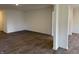 Open-concept living area with hardwood floors and neutral paint, perfect for entertaining at 11015 Walter Dr, Indianapolis, IN 46235