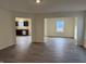 Inviting living area with hardwood floors leading into an adjacent kitchen, offering a seamless flow at 11015 Walter Dr, Indianapolis, IN 46235