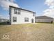 Backyard featuring a well-maintained lawn and the rear exterior of the two-story home at 140 Velvet Hat Rd, Danville, IN 46122