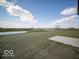 Expansive backyard view overlooking a serene lake and green spaces, perfect for outdoor enjoyment at 140 Velvet Hat Rd, Danville, IN 46122