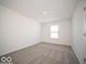 Bright bedroom with a large window and soft carpeting for comfortable living at 140 Velvet Hat Rd, Danville, IN 46122