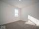 Cozy bedroom with carpeted floors and natural light streaming through the window at 140 Velvet Hat Rd, Danville, IN 46122