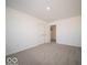 This carpeted bedroom has white walls, a double closet and leads to other rooms in the house at 140 Velvet Hat Rd, Danville, IN 46122
