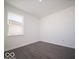 Interior view of a bedroom with gray wood floors and natural lighting during the day at 140 Velvet Hat Rd, Danville, IN 46122