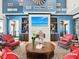 Inviting seating area features a fireplace, mounted tv, and cozy chairs and couches at 140 Velvet Hat Rd, Danville, IN 46122