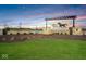 Miles Farm entrance sign with stone accents, professional landscaping and picturesque sky at 140 Velvet Hat Rd, Danville, IN 46122