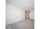 Carpeted loft space with a view of the stairway, offering a versatile area for relaxation at 140 Velvet Hat Rd, Danville, IN 46122