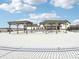 Community building featuring multiple pergolas, modern design, and snowy surroundings on a sunny day at 140 Velvet Hat Rd, Danville, IN 46122