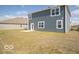 Grassy backyard with patio, perfect for entertaining and relaxation at 146 Velvet Hat Rd, Danville, IN 46122