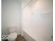 A clean bathroom features a toilet and a white tub with shower at 146 Velvet Hat Rd, Danville, IN 46122