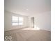 Light-filled bedroom with neutral carpet and a large window at 146 Velvet Hat Rd, Danville, IN 46122