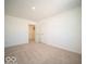 An expansive bedroom offers neutral carpet, white walls, and double doors for closet or storage at 146 Velvet Hat Rd, Danville, IN 46122