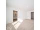 Bright bedroom featuring an ensuite bathroom, neutral carpet, and white walls at 146 Velvet Hat Rd, Danville, IN 46122