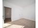 Spacious bedroom featuring neutral carpet, white walls, and a large doorway at 146 Velvet Hat Rd, Danville, IN 46122