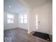 Bright entryway featuring luxury vinyl plank flooring and ample natural light at 146 Velvet Hat Rd, Danville, IN 46122