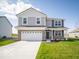 Charming two-story home with a two-car garage and well-manicured lawn at 146 Velvet Hat Rd, Danville, IN 46122