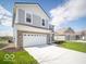 Attractive two-story home showcasing a large driveway and manicured lawn at 146 Velvet Hat Rd, Danville, IN 46122
