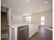 Bright kitchen with a large island, stainless steel appliances and view to the backyard at 146 Velvet Hat Rd, Danville, IN 46122