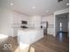 Modern kitchen with stainless steel appliances, white cabinets, and center island at 146 Velvet Hat Rd, Danville, IN 46122