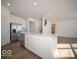 Modern kitchen with stainless steel appliances, white cabinets, and view to the living room at 146 Velvet Hat Rd, Danville, IN 46122