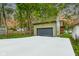 Large detached garage and oversized driveway offer ample parking at 6129 Crittenden Ave, Indianapolis, IN 46220