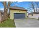 Image of the detached garage including a new driveway and lush lawn at 6129 Crittenden Ave, Indianapolis, IN 46220