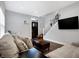 Cozy living room with modern decor, hardwood floors, and a staircase at 6129 Crittenden Ave, Indianapolis, IN 46220