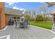 Backyard deck features outdoor dining set and direct access to the yard and playground at 603 Ophelia Dr, Avon, IN 46123