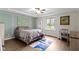Airy bedroom featuring a tray ceiling, accent wall and a large window for plenty of natural light at 603 Ophelia Dr, Avon, IN 46123
