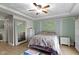 Beautiful bedroom with large mirror, tray ceilings, accent wall and plenty of natural light at 603 Ophelia Dr, Avon, IN 46123