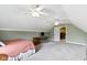 Spacious bedroom with vaulted ceilings, dual ceiling fans, and a door to a closet at 603 Ophelia Dr, Avon, IN 46123