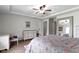 Spacious bedroom featuring a tray ceiling, a modern ceiling fan and a large window at 603 Ophelia Dr, Avon, IN 46123
