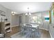 Bright dining room featuring hardwood floors, white furniture, and an open layout for seamless entertaining at 603 Ophelia Dr, Avon, IN 46123