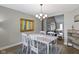 Inviting dining room with hardwood floors, modern decor, and seamless transition to the adjacent living room at 603 Ophelia Dr, Avon, IN 46123