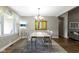 Charming dining room with hardwood floors, ample natural light, and a stylish area rug at 603 Ophelia Dr, Avon, IN 46123