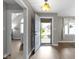 Bright entryway with hardwood floors, showing the living room and dining area at 603 Ophelia Dr, Avon, IN 46123