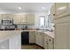 Well-lit kitchen features tile floors, a stainless sink, updated cabinets, and modern appliances at 603 Ophelia Dr, Avon, IN 46123