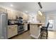 Updated kitchen showcasing tile floors, stainless steel appliances, and a convenient island with barstool seating at 603 Ophelia Dr, Avon, IN 46123