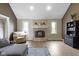 Comfortable living room features a brick fireplace with white mantle and large windows for natural light at 603 Ophelia Dr, Avon, IN 46123