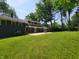 Expansive backyard, featuring a patio and lush lawn, perfect for outdoor entertaining and relaxation at 6205 Bramshaw Rd, Indianapolis, IN 46220